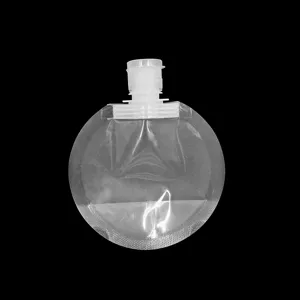 Gros plan sur la poche cosmétique ronde transparente, design de sac de voyage pour lotion.