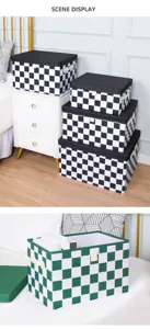 Boite de rangement pliable en tissu Oxford avec motif damier pour organiser la penderie.