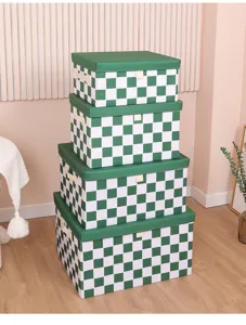 Boîte de rangement en tissu à carreaux verts pliable pour vêtements et jouets de placard.