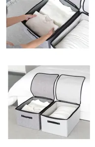 Detail van grijze stoffen opbergdoos, opvouwbare organizer met handvatten voor kleding.