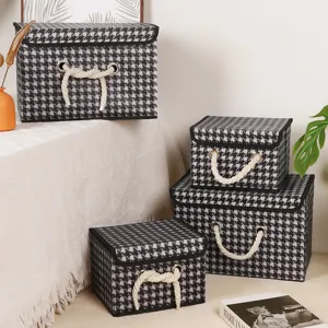 Foldable black and white houndstooth fabric storage boxes with lids and rope handles for home.