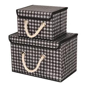 Foldable fabric storage box with houndstooth pattern, lid and rope handles for wardrobe organization.