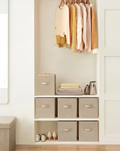Detail view showing foldable fabric storage box neatly organized in modern home closet.