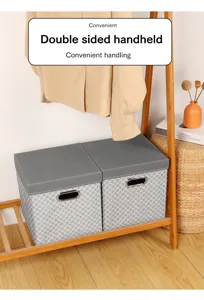 Foldable fabric storage box with grey lid, geometric pattern and convenient double-sided handles.