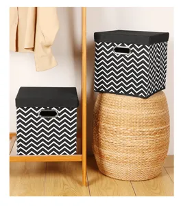 Foldable fabric storage box with lid, black and white chevron pattern home organizer detail view.