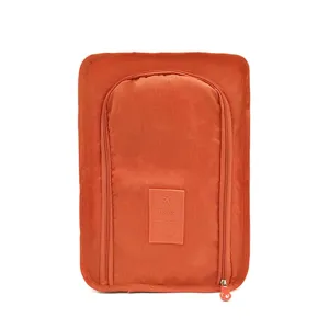 Borsa per scarpe da viaggio arancione portatile organizer con chiusura a cerniera.