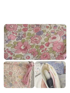 Floral print mini storage pouch detail view showing cute floral fabric and zipper design.
