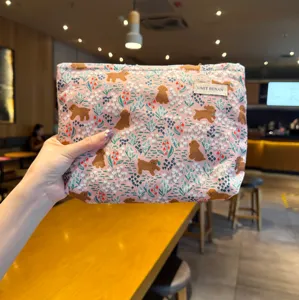 Cute pink puppy print cosmetic pouch, portable fabric toiletry and makeup storage bag for daily use.