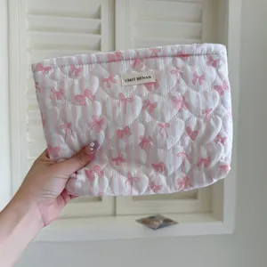 Quilted makeup bag with pink stripes and cute bows, large capacity cosmetic storage pouch.