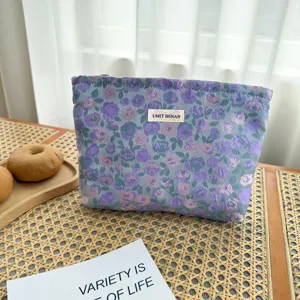 Pochette cosmetica floreale con cerniera, tessuto jacquard intrecciato, borsa per trucco.