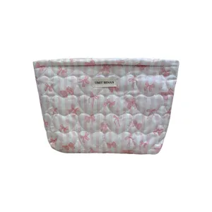 Pink quilted cosmetic bag with heart and bow print, large capacity makeup pouch main view