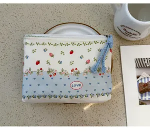 Canvas strawberry print pouch with zipper, cute cosmetic storage bag for daily use.