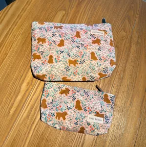 Cute puppy pattern cosmetic bag detail, pink floral makeup pouch, portable storage.