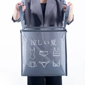 Grey mesh laundry basket foldable clothes storage hamper with handles for dorm room daily use.