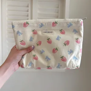 Cute strawberry bow cosmetic bag, large capacity portable makeup storage pouch for travel.