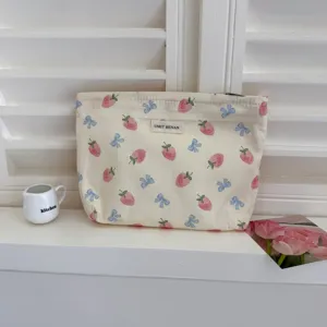 Cute strawberry bow makeup bag, large capacity portable cosmetic pouch for travel and daily use.