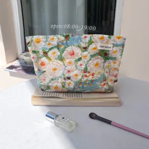 Oil painting floral makeup bag detail, large capacity travel cosmetic pouch for essentials.