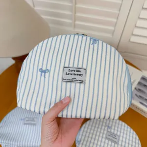 Blue striped embroidered bow makeup pouch cosmetic bag portable fabric storage organizer detail