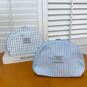 Blue plaid and striped cosmetic bag, canvas shell makeup pouch with cute bow embroidery.