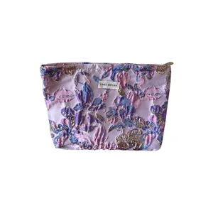 Borsa cosmetica jacquard floreale vintage viola chiaro con cerniera ed etichetta.