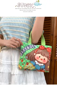 Cute green plaid canvas handbag with cartoon girl print and top handle for women daily use.