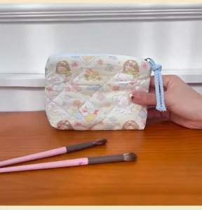 Cute quilted cosmetic bag with cartoon puppy and girl pattern, portable zipper pouch.