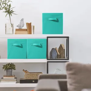 Foldable fabric storage boxes with handles for home organization and wardrobe clutter.