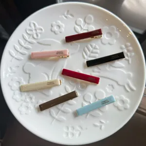 Assorted colorful acrylic duckbill hair clips set, glossy surface detail display.