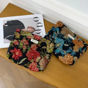 Retro floral jacquard cosmetic bag and travel pouch set featuring elegant vintage flower patterns.