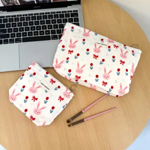 Cute canvas cosmetic bag with bunny and tulip print, portable travel makeup storage pouch set.
