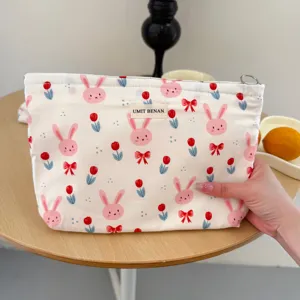 Cute cartoon rabbit canvas cosmetic bag, large capacity portable travel storage pouch for women.