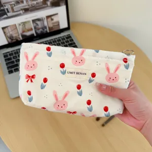 Canvas cosmetic pouch with cute rabbit and tulip print, portable travel makeup storage bag for women.