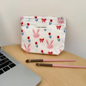 Canvas makeup pouch featuring cute bunny and tulip print, portable travel cosmetic storage bag.
