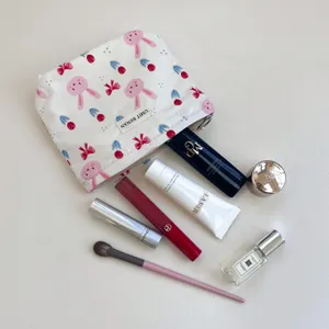 Detailed view of cute rabbit canvas makeup pouch with neat cosmetic props displayed.