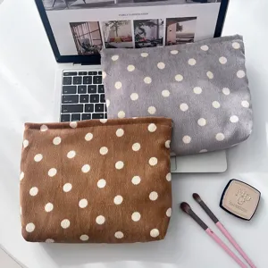 Corduroy polka dot cosmetic bag in retro style, soft storage organizer pouch for travel toiletries.