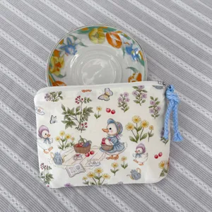 Cute cartoon duck canvas zipper pouch detail, portable makeup and coin storage bag for daily use.