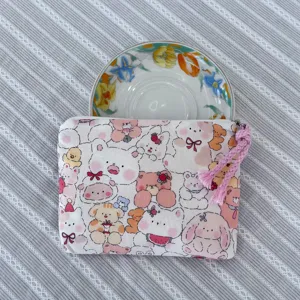 Cute cartoon printed zipper cosmetic bag for daily storage, portable makeup pouch with tassel.