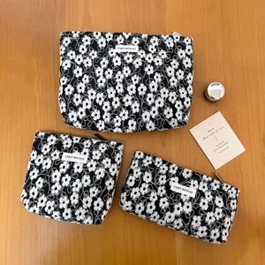 Black floral cosmetic bag set, large capacity portable makeup pouch for women and travel.