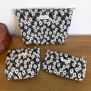 Black floral cosmetic bag set, large capacity makeup pouch, portable toiletry organizer.