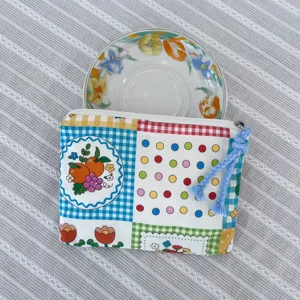 Cute cartoon patchwork makeup bag portable zipper coin purse for daily small items storage.