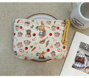Portamonete in tela stampata con coniglietto carino e borsa da viaggio portatile.