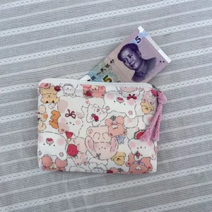 Cute cartoon bear canvas coin purse with pink tassel zipper, portable makeup and storage bag.