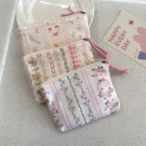 Cute floral cotton zipper pouch mini coin purse portable makeup storage bag for daily use.
