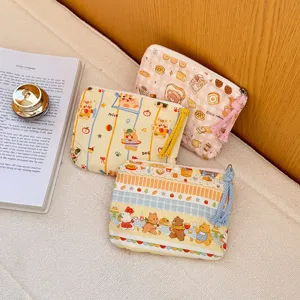 Cute cartoon canvas coin purse portable cosmetic storage bag with adorable bear and bread print.