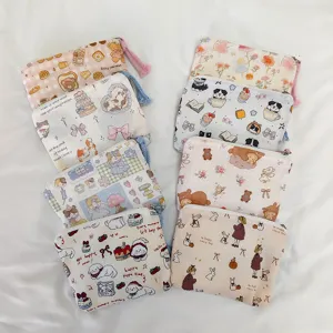 Cute canvas mini coin purse and lipstick makeup storage bag with lovely cartoon patterns.