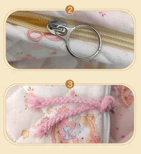 Close-up detail of cute cartoon animal print cosmetic bag showing delicate quilting and zipper.