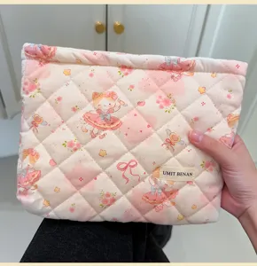 Cute quilted cosmetic pouch with cartoon animal print, large capacity travel storage bag.