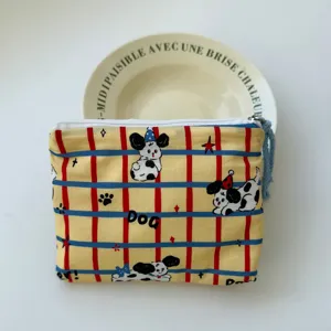 Cute yellow plaid cosmetic bag with cartoon dog print, portable travel zipper pouch for daily use.