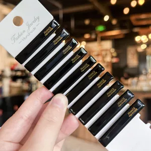 Black acrylic duckbill hair clips set on display card, elegant hair styling accessories.