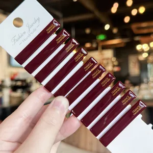 Detailed view of dark red acrylic hair clips featuring handmade design with card display.